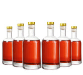 Kaachli clear bottle 12oz pour-focused image for easy beverage serving.