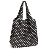 Kate Spade New York reusable tote in black dots with roll-up design for easy storage.