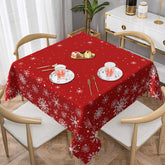 Kawani Merry Christmas tablecloth 54inch on dining table with festive red snowflakes.