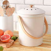 KIBAGA countertop compost bin with lid for odor control on busy kitchen counters.