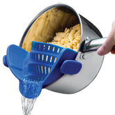 Kitchen Gizmo Snap N' Strain blue clip-on silicone strainer attached to pot for quick draining.