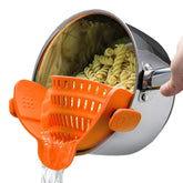 Kitchen Gizmo Snap N Strain clip-on strainer attached to a pot for hands-free draining.