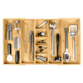 KitchenEdge adjustable bamboo drawer organizer expands to fit wide utensil drawers.