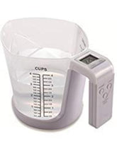 KitchenMetrics digital scale with measuring cup in use for precise cooking