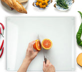 Kitchenville glass cutting board top view showing 20x16 size and prep-ready surface.