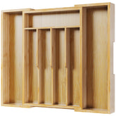 Kitsure expandable bamboo silverware organizer in a spacious drawer keeps utensils neatly organized.