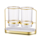 Kivsty silverware holder with gold stand for elegant tabletop organization.
