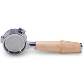 KNODOS bottomless portafilter with maple handle shows naked head for visible extraction feedback.