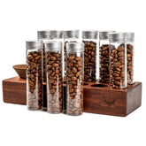 KNODOS single-dose tubes on a wooden stand for organized espresso prep.