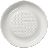 KYOCERA ceramic grater with conical blades for fast, even grating.