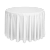 Lann's Linens 120-round tablecloth in wedding setup showing elegant drape and pristine white surface.
