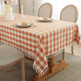 Laolitou checkered fall tablecloth in orange enhances farmhouse dining ambiance.