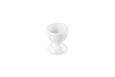 Le Creuset egg cup 2-inch white with smooth glaze for easy release.