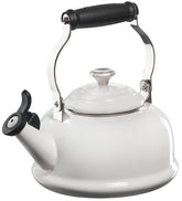 Le Creuset whistling tea kettle front view highlights quick heat and vibrant enamel finish.
