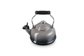 Le Creuset enamel steel kettle with a whistle alert signaling boiling.