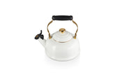 Le Creuset enamel on steel kettle on stove heats water quickly for tea.