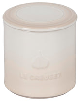 Le Creuset Garlic Keeper Meringue on countertop keeps ready-to-use garlic at hand.