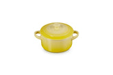 Le Creuset mini round cocotte Soleil top view highlighting vibrant glaze for individual servings.