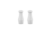 Le Creuset white salt and pepper shakers—side view, durable stoneware for daily use.
