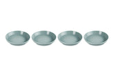 Le Creuset Sea Salt pasta bowls on table show vibrant color and sturdy construction for everyday meals.