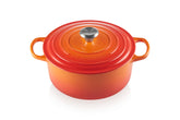 Le Creuset Signature round Dutch oven in flame exterior highlights durability and color for searing and braising.