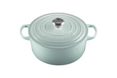 Le Creuset Signature Round Dutch Oven Sea Salt with lid on, durable enamel finish in focus