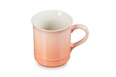 Le Creuset Vancouver Mug Peche 14oz front view with bold color and ample capacity.