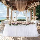 Little Funny white 6ft rectangle stretch ruffle tablecloth closeup highlights elegant tulle detail.