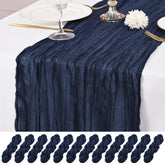 Lumaycens navy blue cheesecloth table runner drapes elegantly for weddings and receptions.