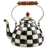 MacKenzie-Childs enamel tea kettle with Courtly Check on the stovetop for stylish tea