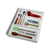 Madesmart Classic four-compartment drawer organizer keeping utensils neatly arranged.