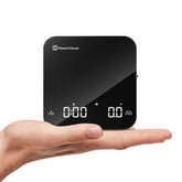 Maestri House mini coffee scale in palm size for precise espresso measurements.