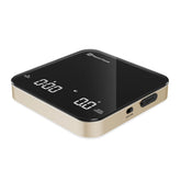 Maestri House Mini Coffee Scale with timer held in palm for precise dosing.