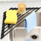 MERRYBOX triangle roll-up over-sink rack viewed from above, space-saving design.