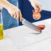 MEWSDEN acrylic cutting board with juice groove keeps counters clean during prep.