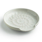 Miamolo spoon rest on stove top, white ceramic keeps counters tidy