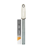 Microplane cashmere beige zester citrus blade captures zest for bright vinaigrettes and pastries.