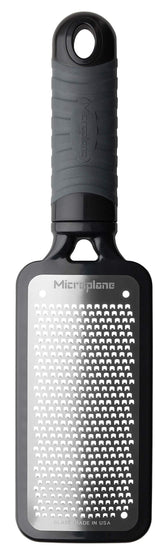 Microplane Home Series fine cheese grater in black with soft-touch handle for fine grating.