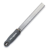Microplane Premium Classic Parmesan Grater Grey delivering delicate parmesan shavings.