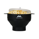 Mindful Design collapsible popcorn bowl in microwave for space-saving movie nights.