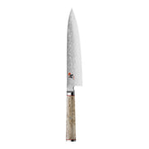 Miyabi Birchwood SG2 8-inch blade close-up shows Damascus pattern for precise slicing.