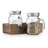 MosJos mason jar salt and pepper shakers on a wooden holder for easy seasoning.