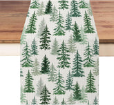 Moutina Christmas runner with green pine trees enhances festive dining.