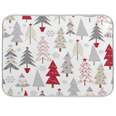 Nander dish drying mat 16x18 with Christmas tree motif dries dishes on a clean counter.