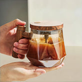 NeovaHome Nordic Glow mug with wood-grain handle for stylish, comfortable coffee sipping.