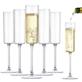 Nervure 6 oz clear plastic champagne flute for parties, easy disposal and clean setup.