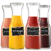 Netany four glass carafes with lids arranged for brunch service.