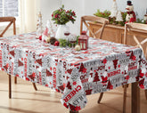 Newbridge Christmas Joy tablecloth on table with Santa print; protects surfaces during holiday meals.