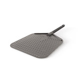 Ninja Woodfire perforated pizza peel with hanging drawstring for easy storage and handling.