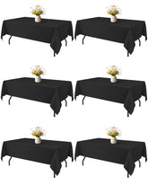 Niuara Black Rectangle Table Cloth draped for a wedding, creating a clean, elegant table setting.
